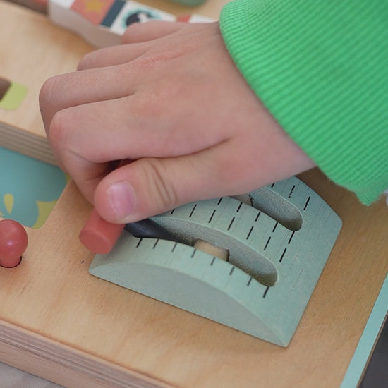 Video of a child playing with the Tenderleaf Toys Space Station Busy Board