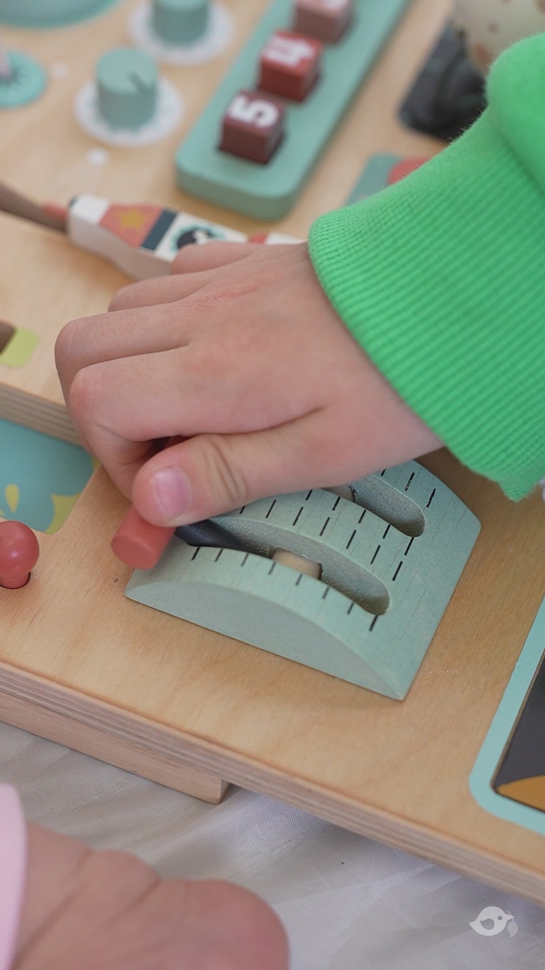 Video of a child playing with the Tenderleaf Toys Space Station Busy Board